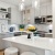 Light Gray Cabinets with White Quartz Countertops and Marble-Inspired Tile Backsplash