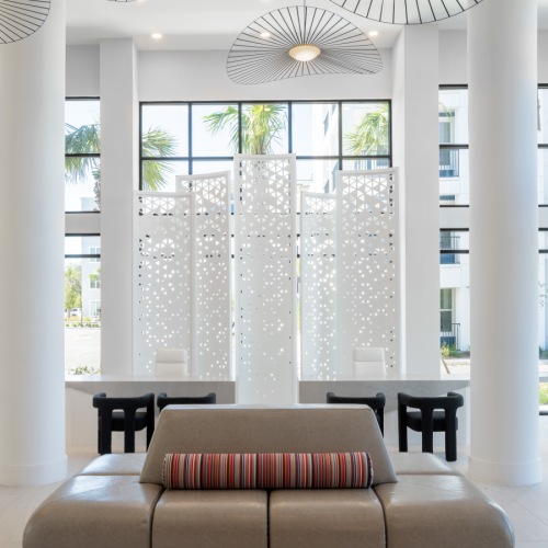 Apartments Near Walt Disney World | Aventon Opal | Shot of the Grand Lobby Featuring Soaring Double-Height Ceilings and Comfortable Seating Apartments Near Walt Disney World | Aventon Opal | Shot of the Grand Lobby Featuring Soaring Double-Height Ceilings and Comfortable Seating